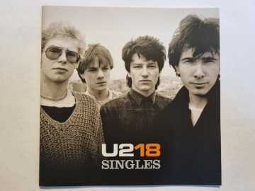 Front cd u2   u218 singles   0602517135499